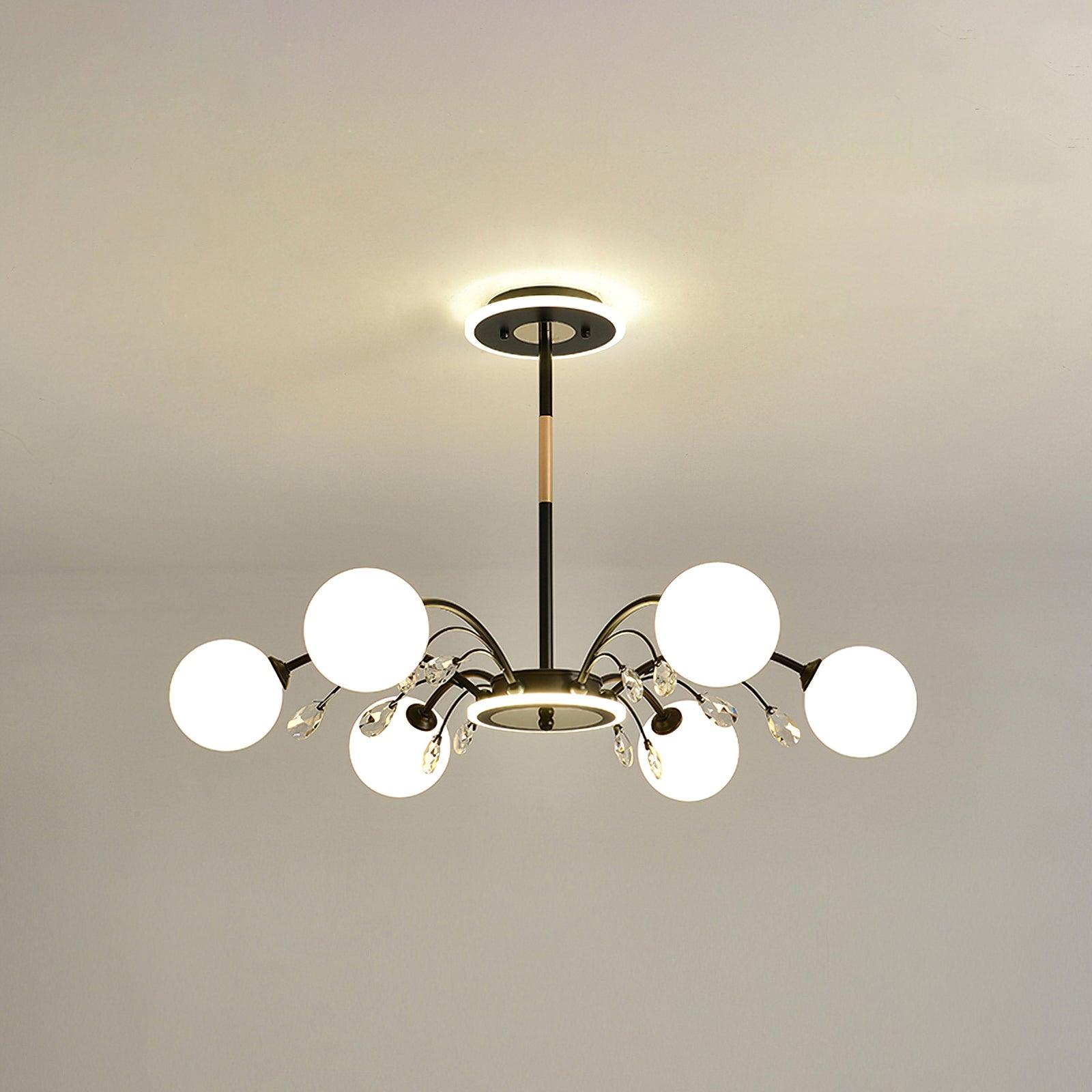 Six-light Black version with white globes, clear faceted drops and warm-metal rod accents, listed at 70 cm diameter