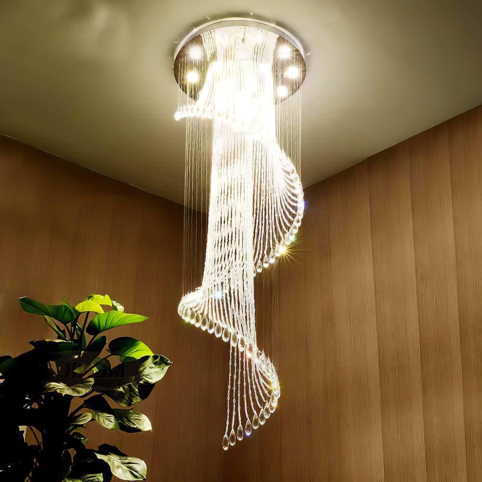 Upward view of bright crystal spiral against brown wood-texture walls, with a leafy plant at left
