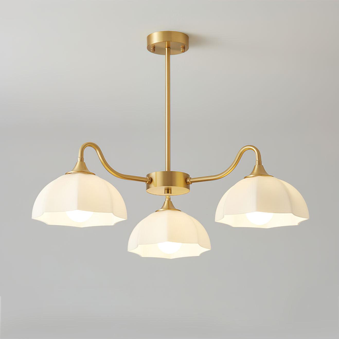 Three-head round brass chandelier with white glass bowls