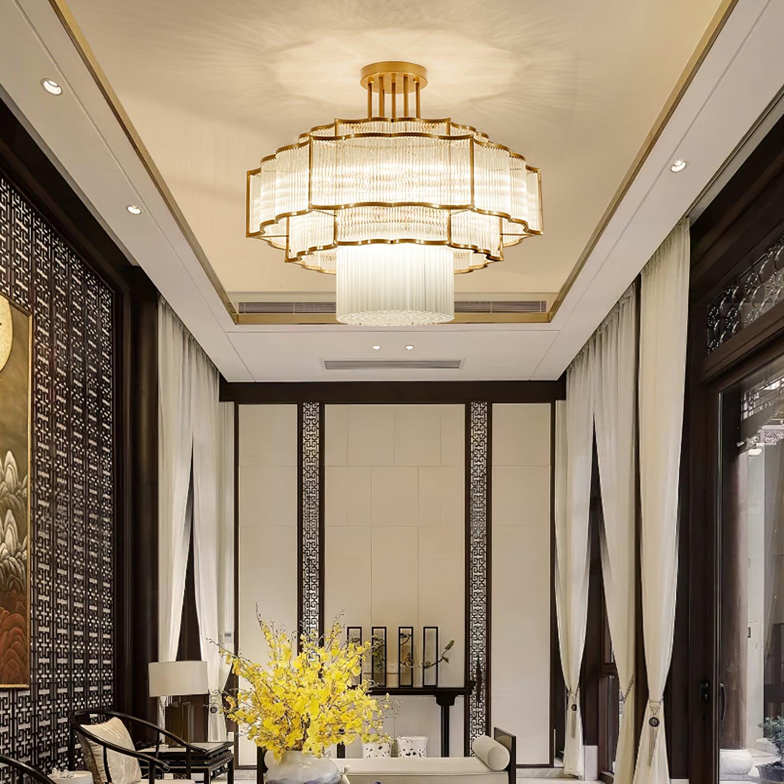 Pharo II tiered chandelier with clear ridged elements and a scalloped metal frame