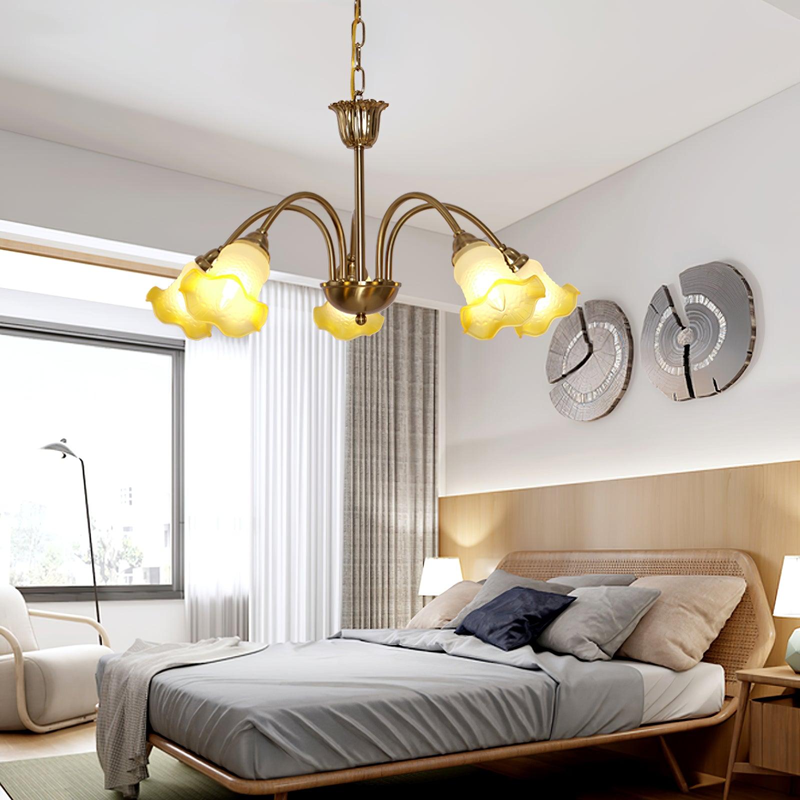 Small Yellow flower chandelier above a bed