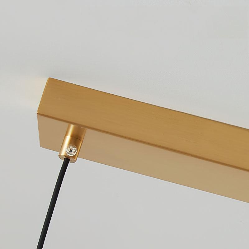 Long brass canopy and black suspension cord close view
