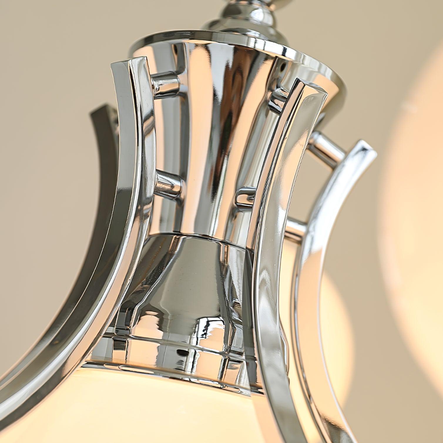 Close-up of the polished chrome flared central housing, curved flat arms and short crosspieces