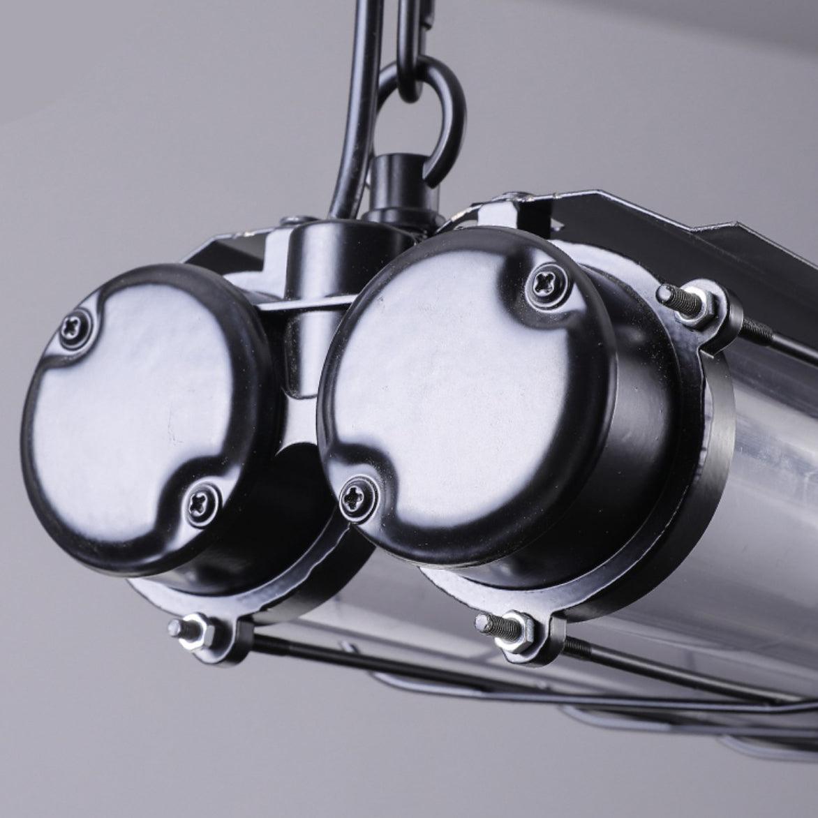 Close view of two black circular end caps and the chain attachment on the paired-channel Artisan Glass chandelier