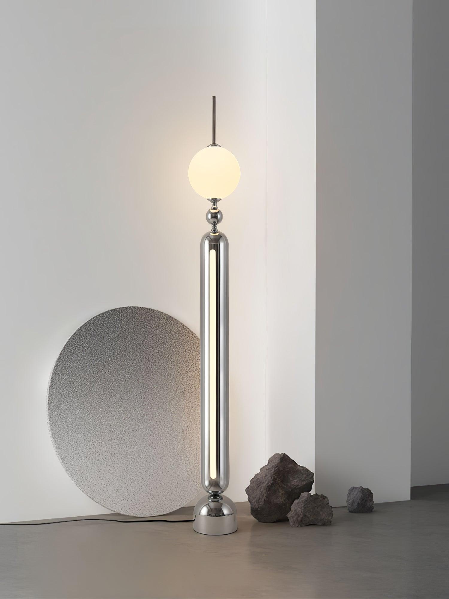 Lightning Rod chrome floor lamp with a white globe and vertical light strip