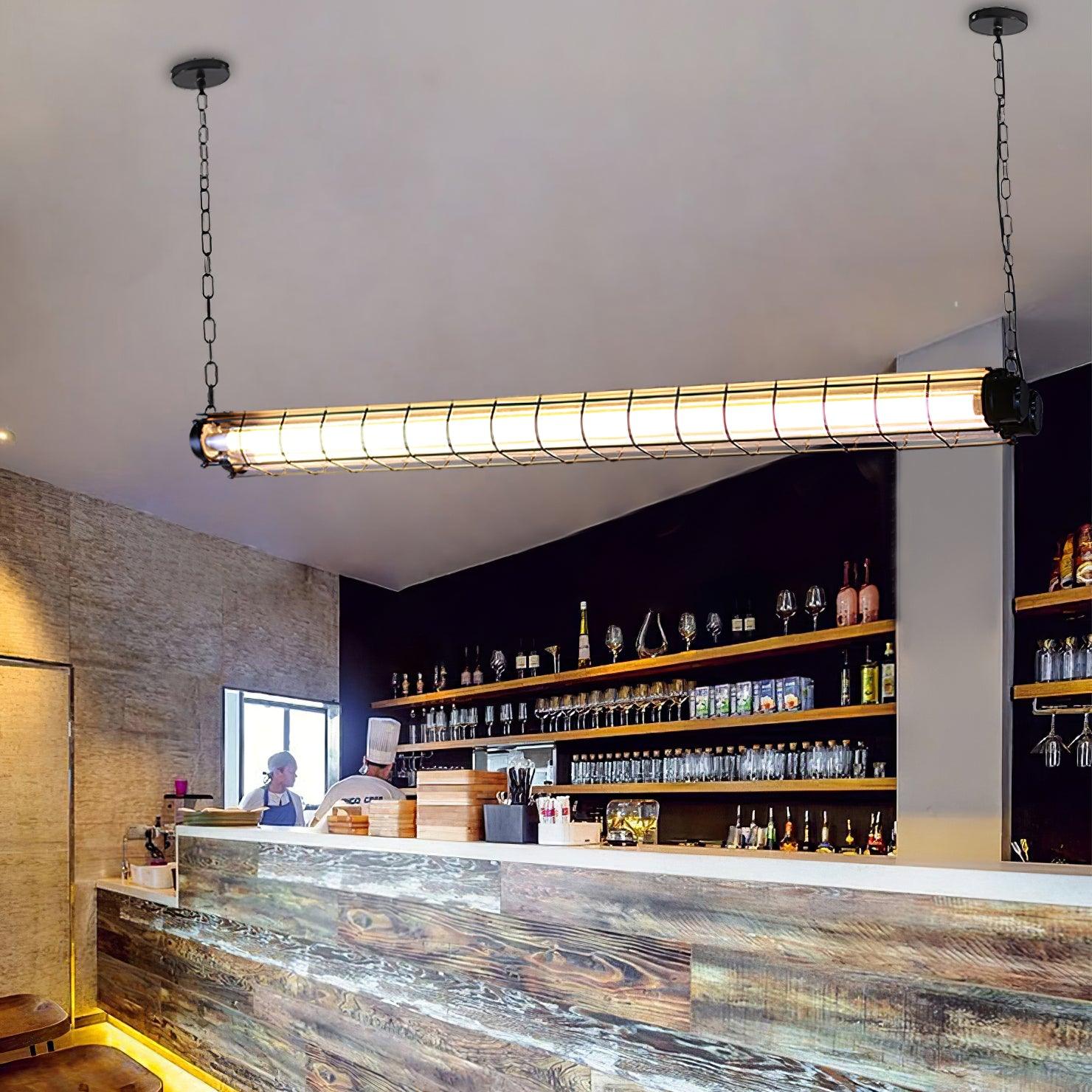 Artisan Glass chandelier above a dark stone bar and rows of bottles