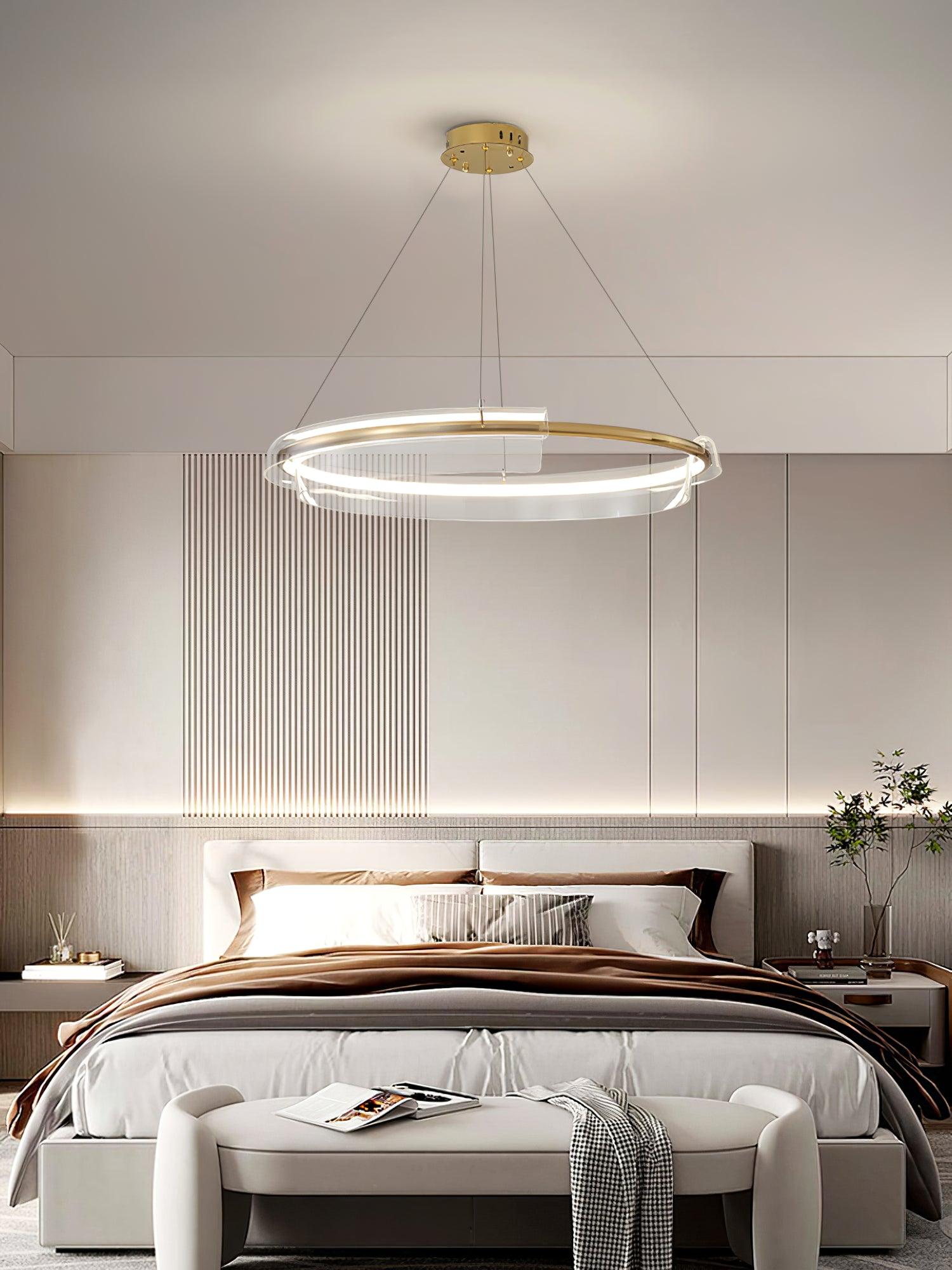 Gold-and-clear ring chandelier in a bedroom