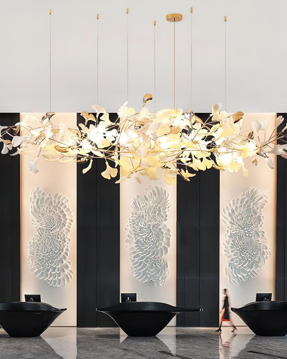 Close crop of horizontal leaf cloud above black reception counters and pale decorative wall panels