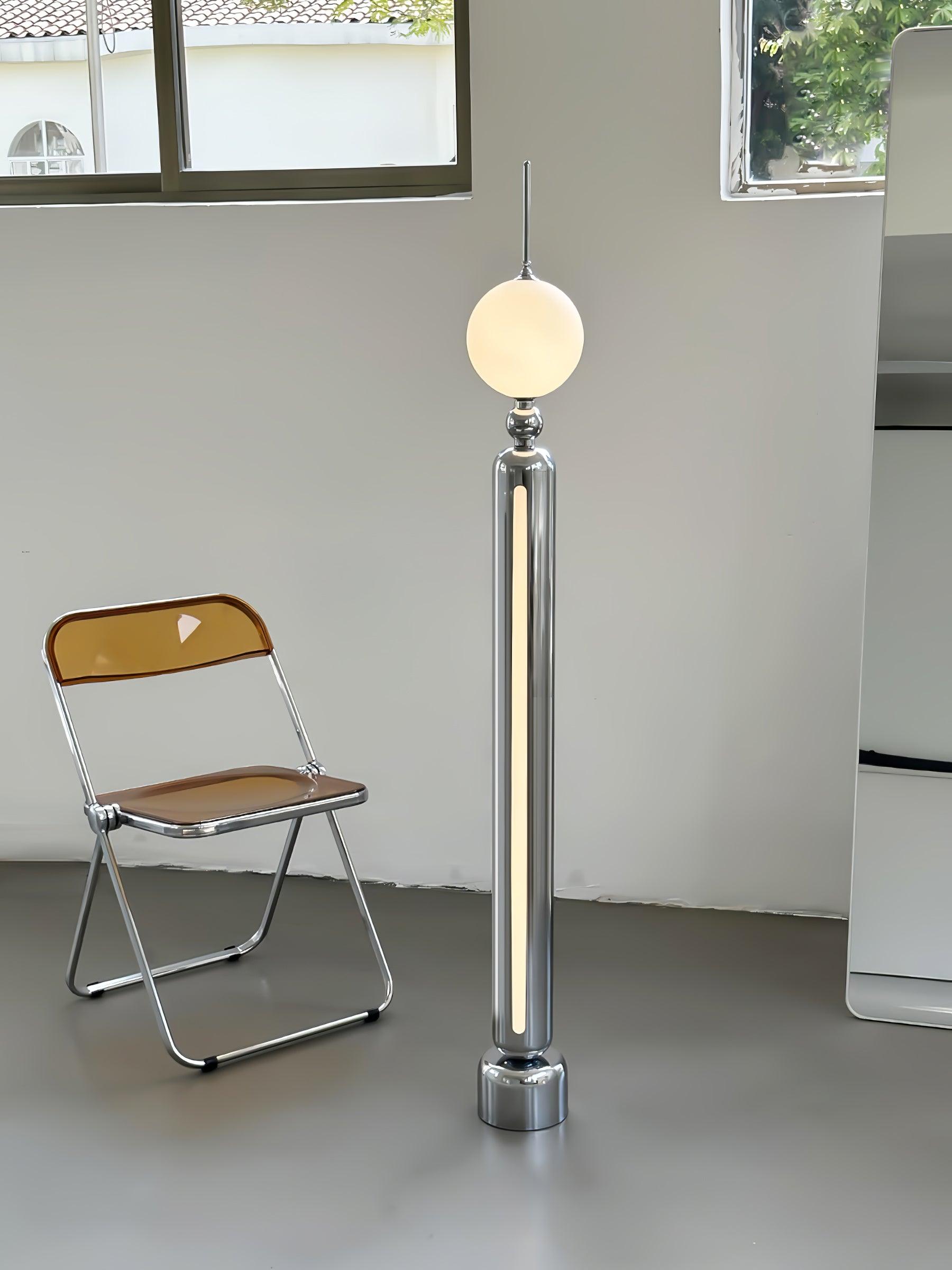 Lightning Rod chrome floor lamp with a white globe and vertical light strip