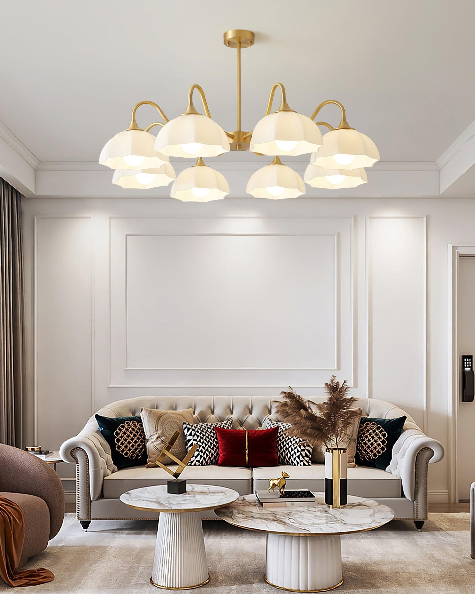 Glass-bowl chandelier hanging over a sofa