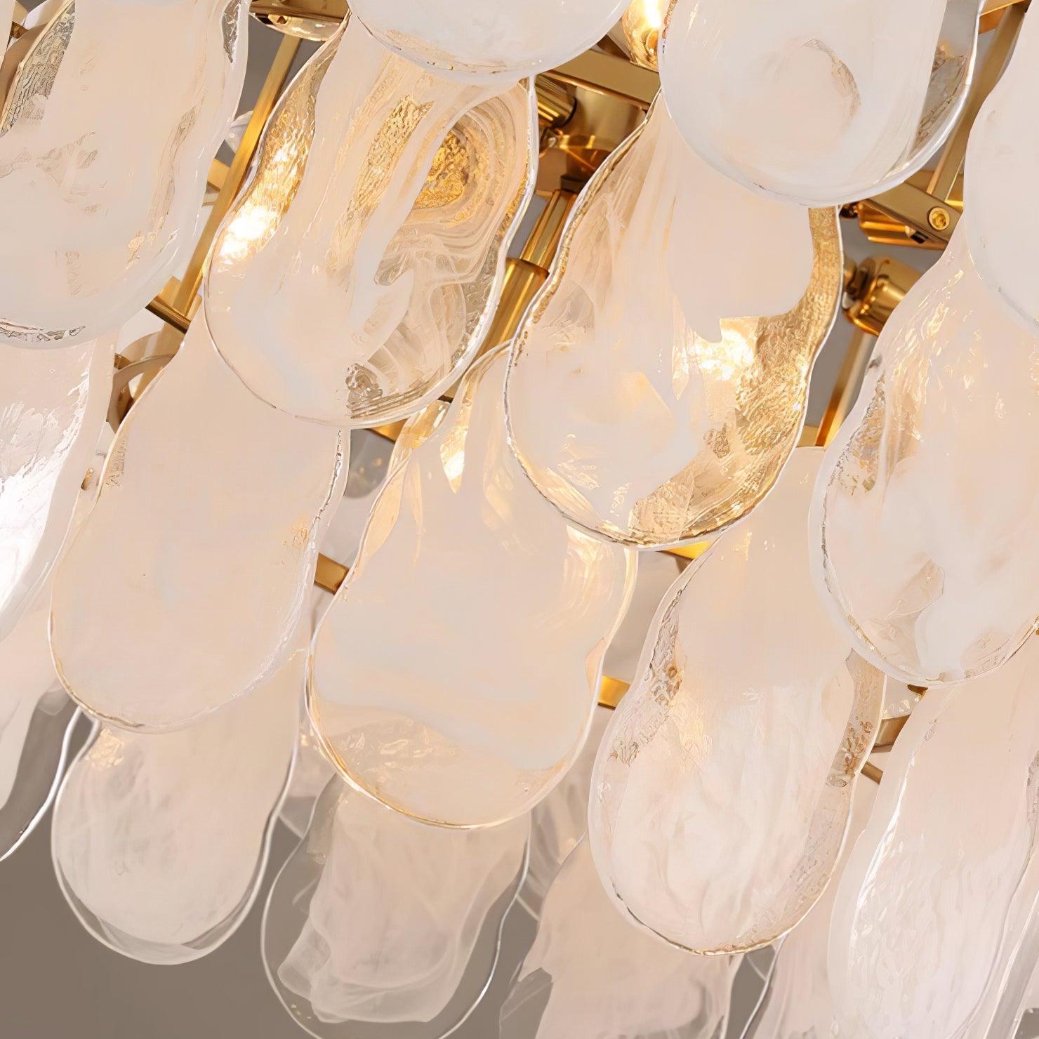 Angled close view of illuminated Round Cloud glass panels beside the gold-tone frame