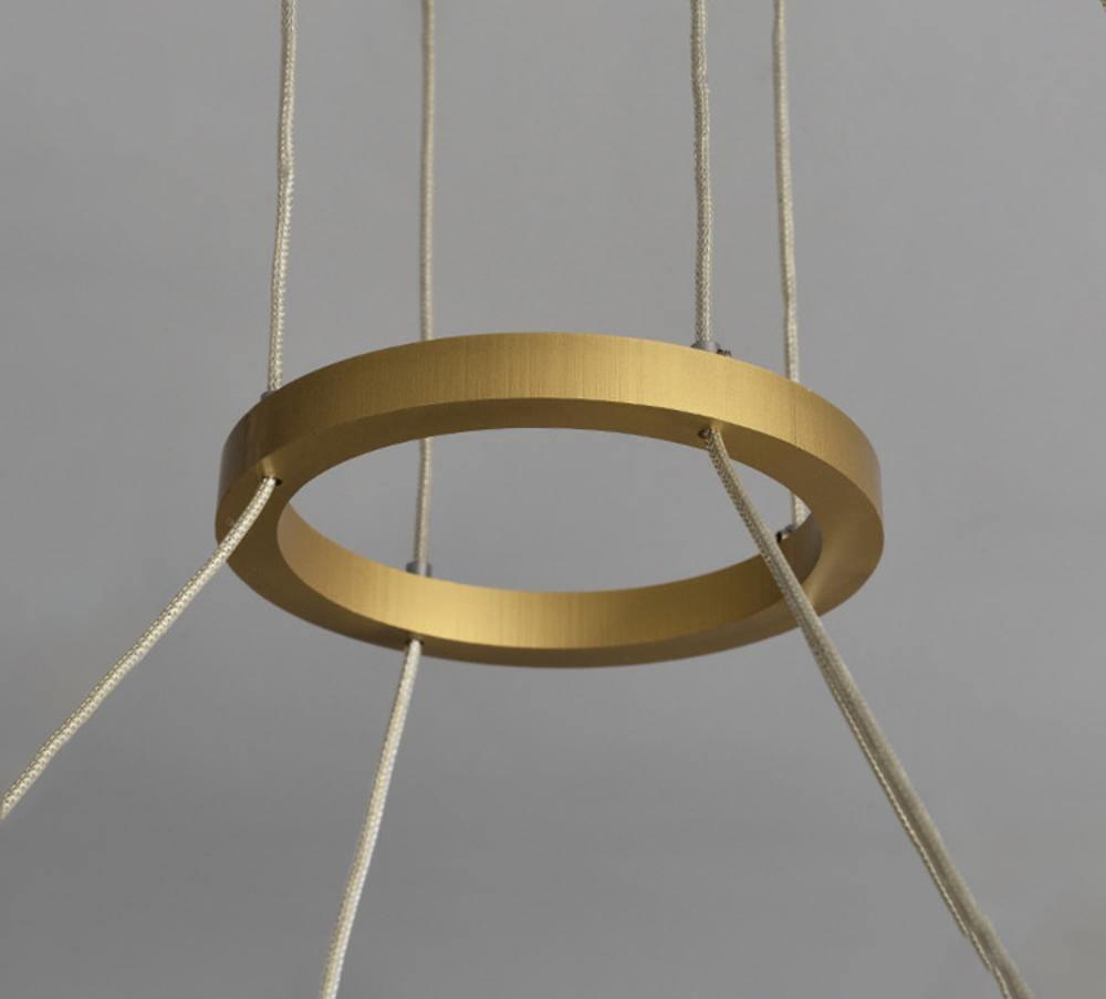 Parallel LED chandelier with textured acrylic bands and gold-tone connectors