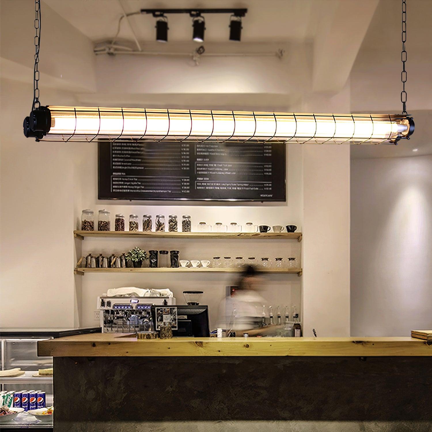 Chain-hung Artisan Glass chandelier above a coffee counter with bottles and wall shelves