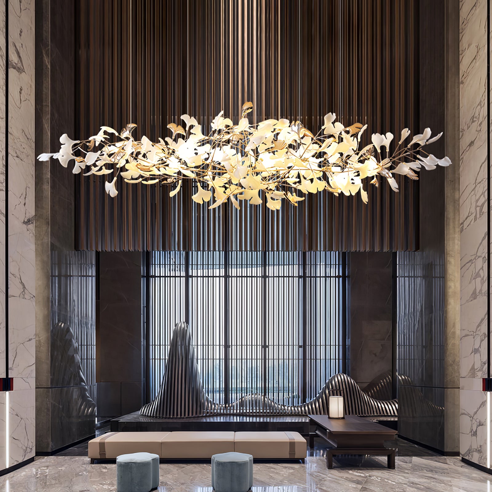 Wide marble lounge with horizontal leaf cloud above pale bench, two blue stools and sculptural dark seating