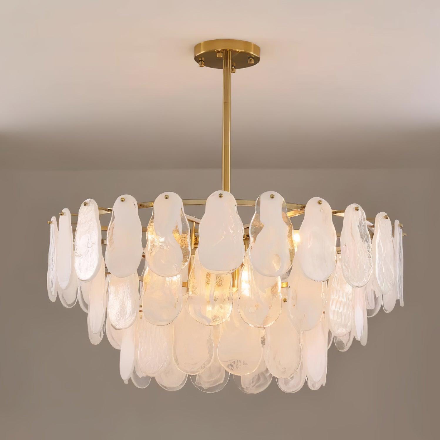 Round Cloud pendant with overlapping glass layers and a central rod against a pale grey background