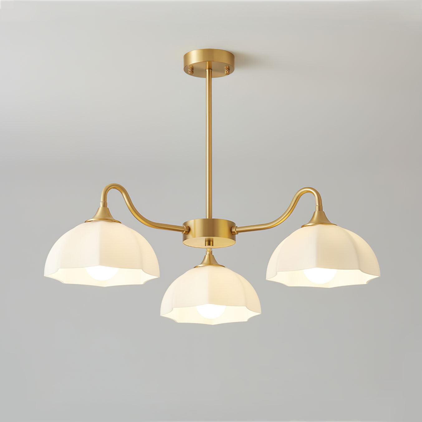 Three-head brass chandelier with down-facing white shades