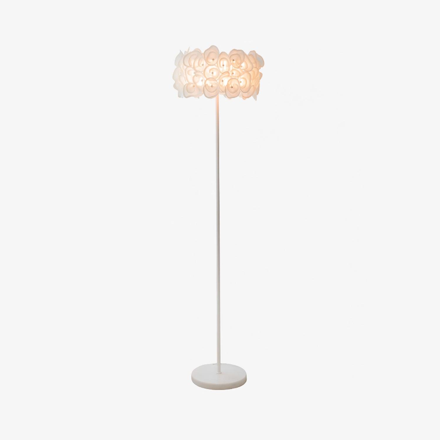 Isolated upright Hydrangea floor lamp on pale gray, warm-lit white petal shade, slim straight pole and pale round base