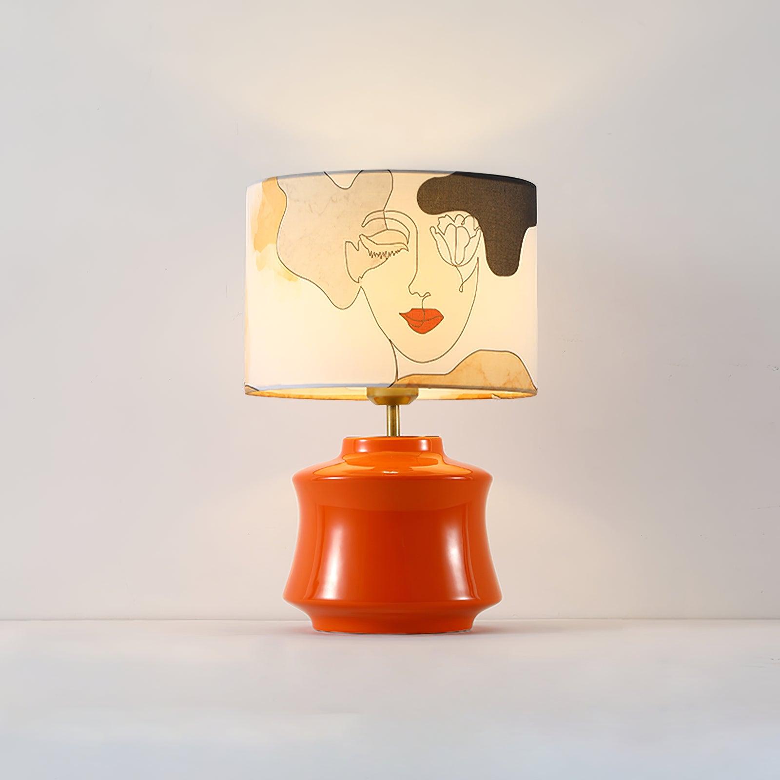 Marilyn table lamp glowing against a pale wall
