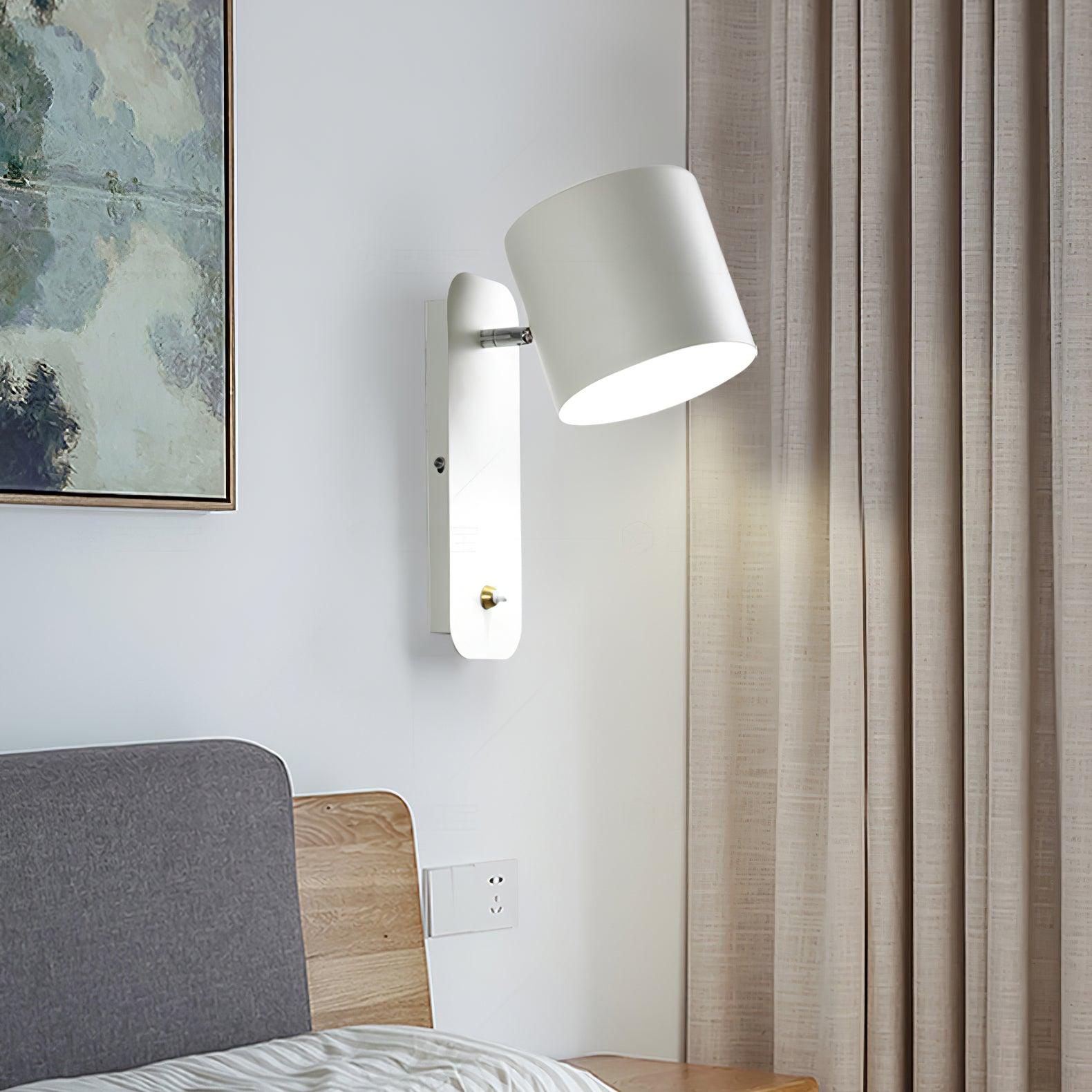 White tilted cylinder near a sofa and curtains