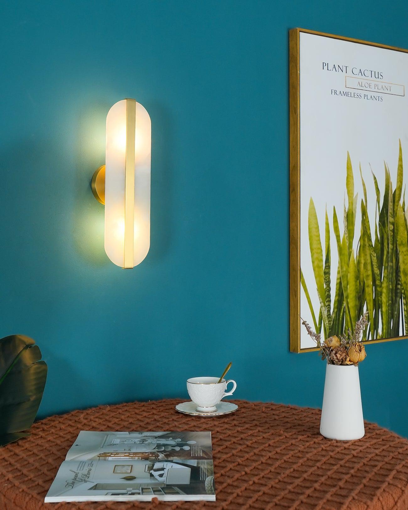 Alabaster sconce above a table and cup