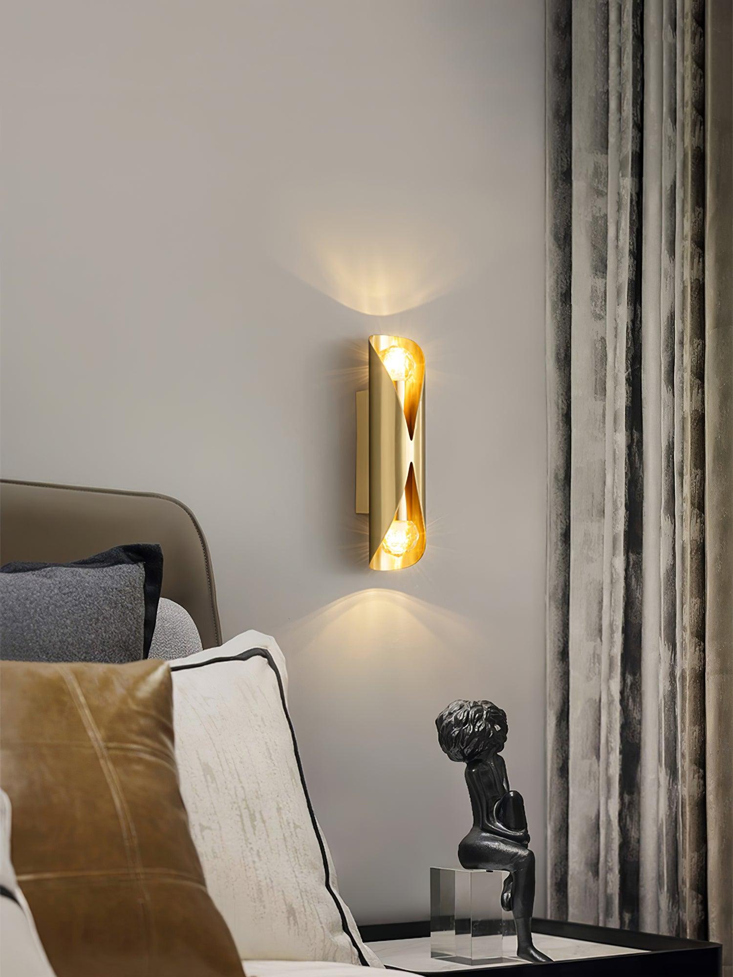 Brass wall lamp near a living-room sofa