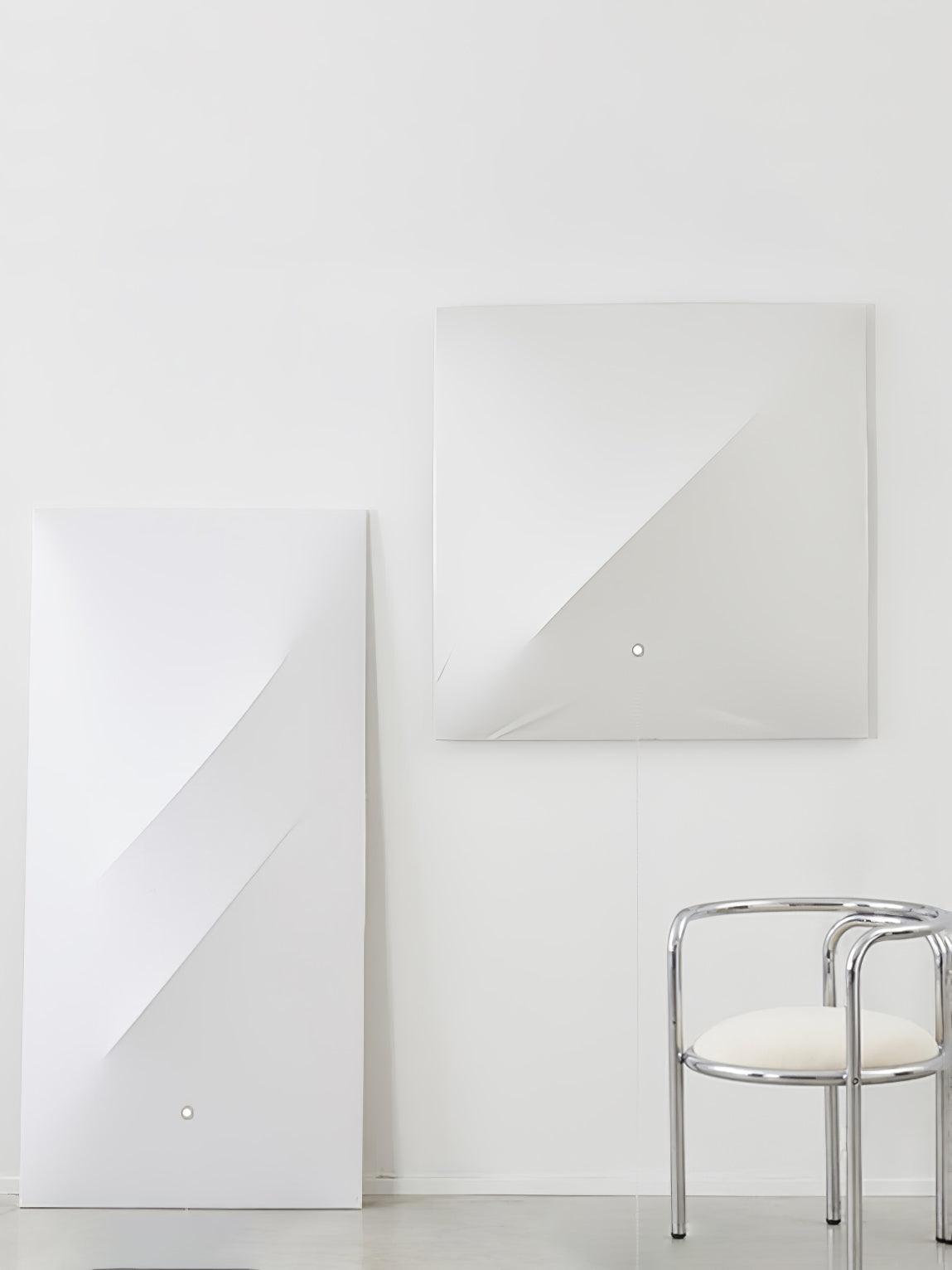 Unlit square and rectangular fabric panels with diagonal folds, small round face details and hanging thin leads