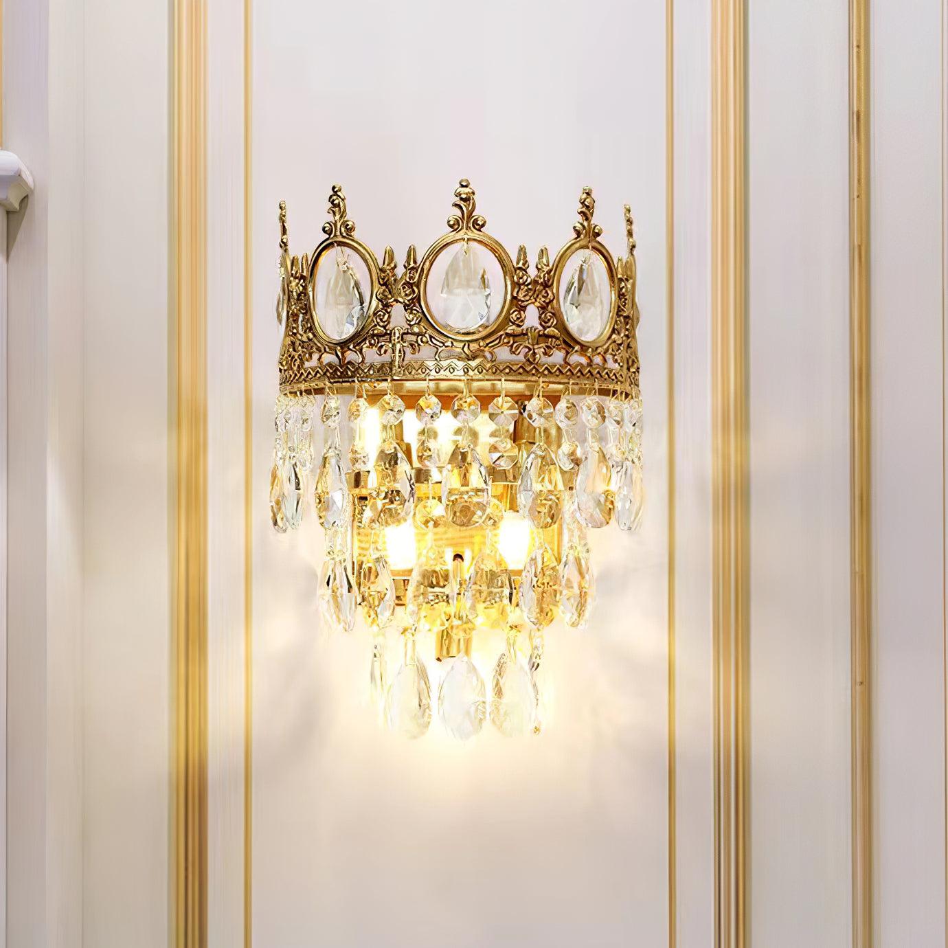 Illuminated crown crystal sconce on wall panelling