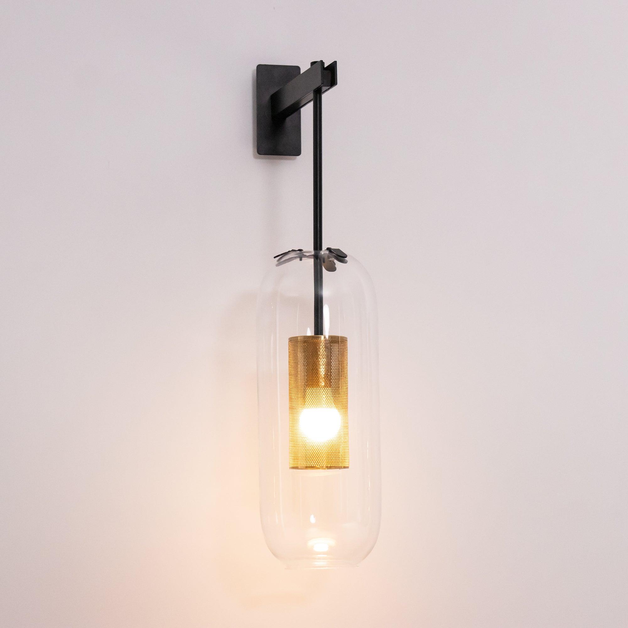 Black Vadim wall fixture illuminated