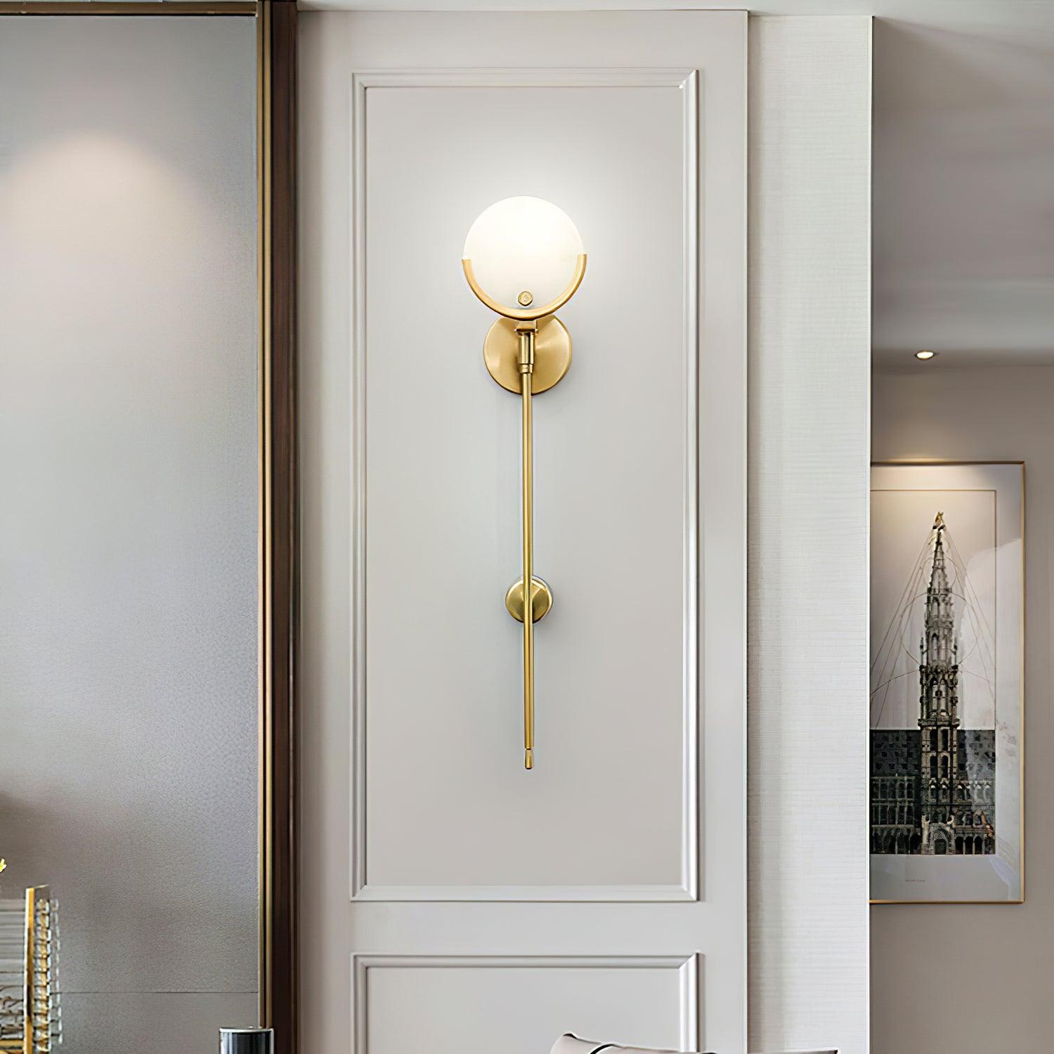 Frontal long-stem Ava fixture in white wall panelling beside a framed architectural picture