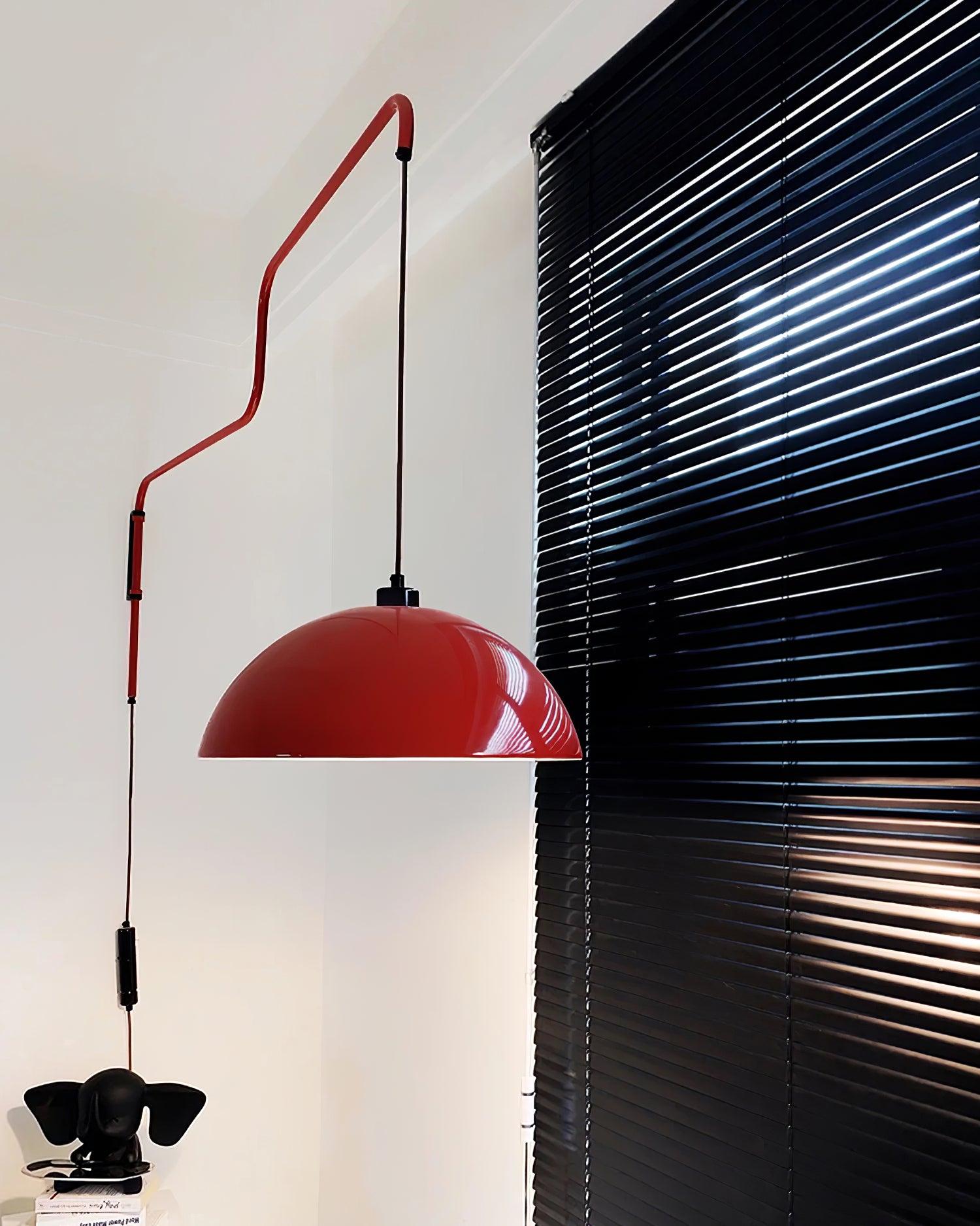 Long angular arm and shade near dark window blinds
