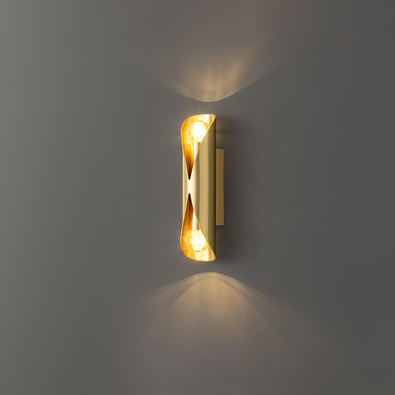 Brass wall fitting emitting light at both ends