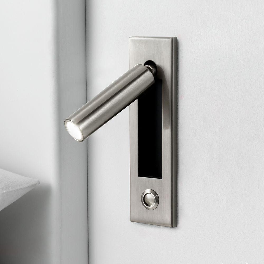 Silver-tone cylindrical reading head with a round button below the recess