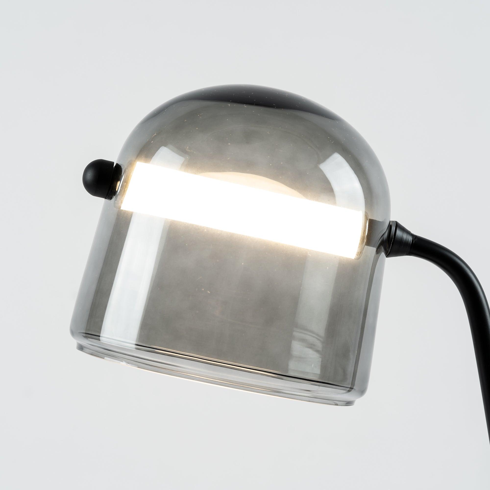 Glowing transverse tube through the Mona glass shade