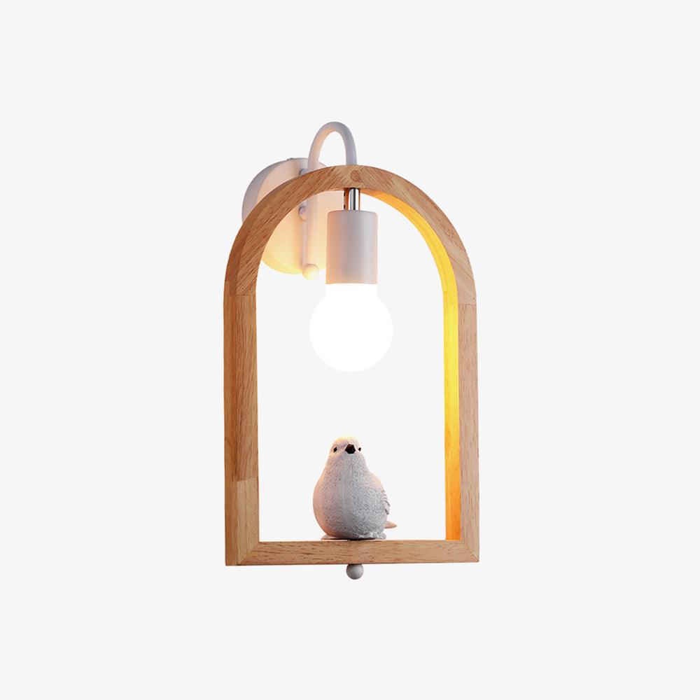 Front view of Model A on white, with a pale bird on the wooden arch’s lower rail, exposed bulb and small bottom finial