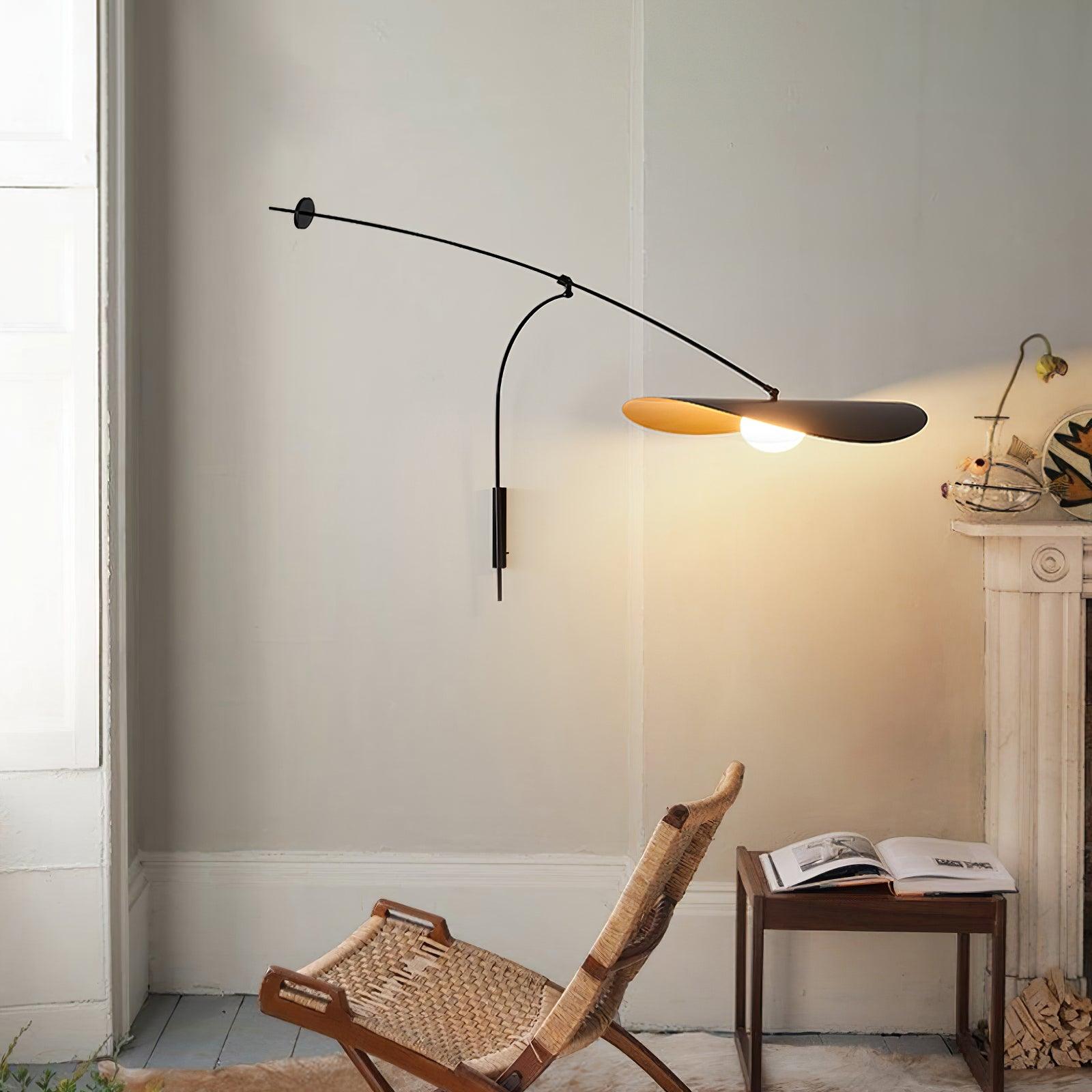 Arcing wall fixture beside a low wooden chair