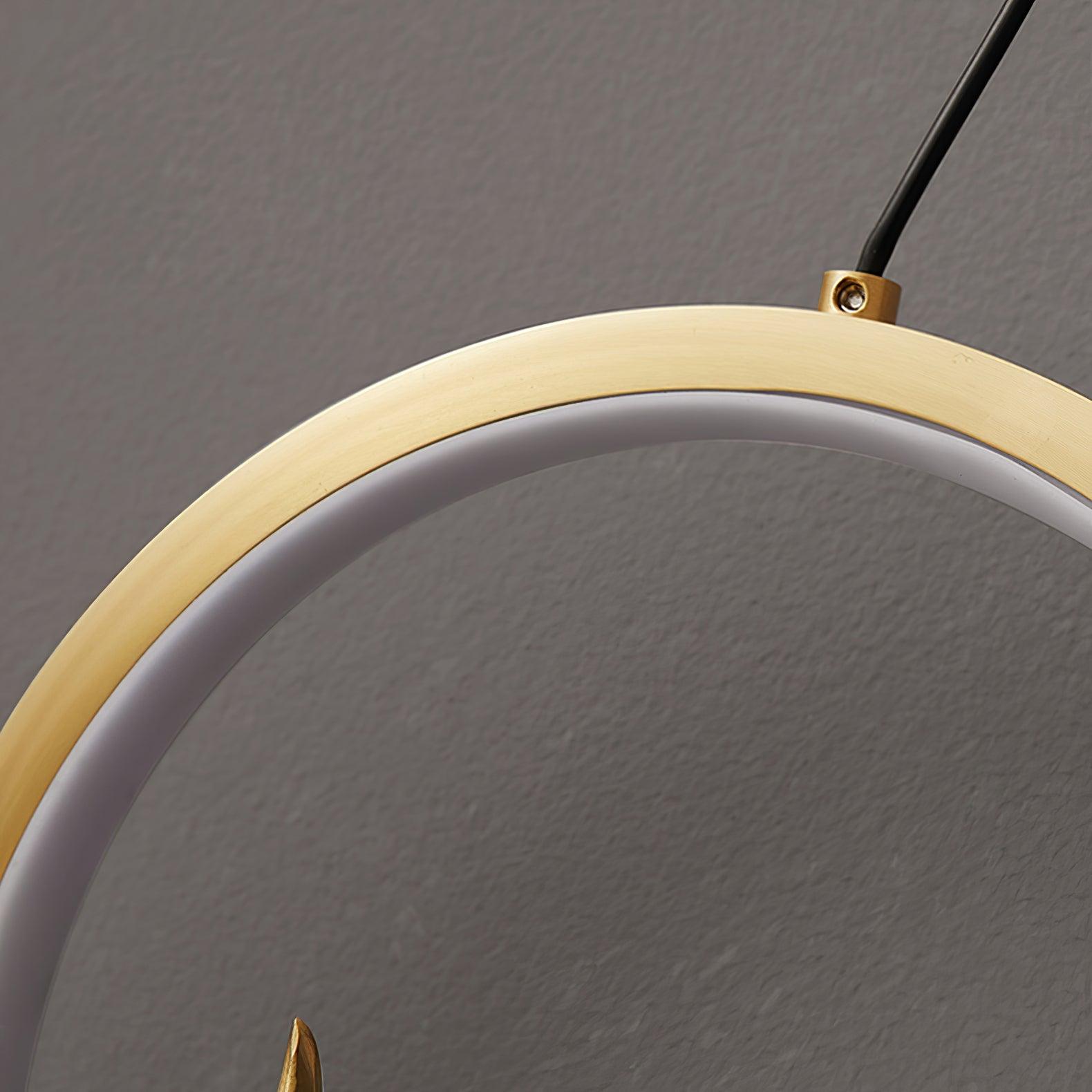 Unlit white inner diffuser and gold-tone ring edge with black strand attachment and screw
