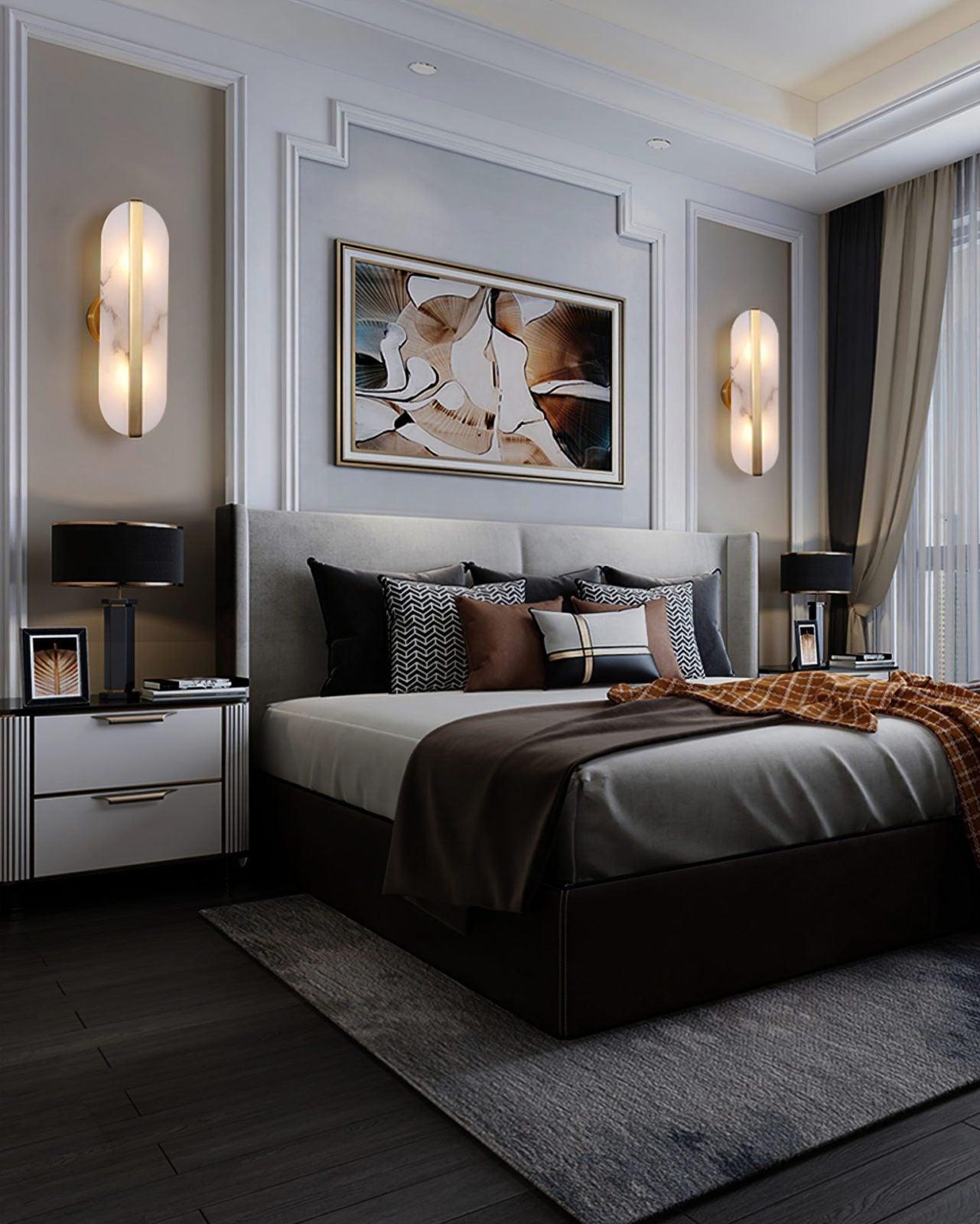 Two elongated sconces beside a bed