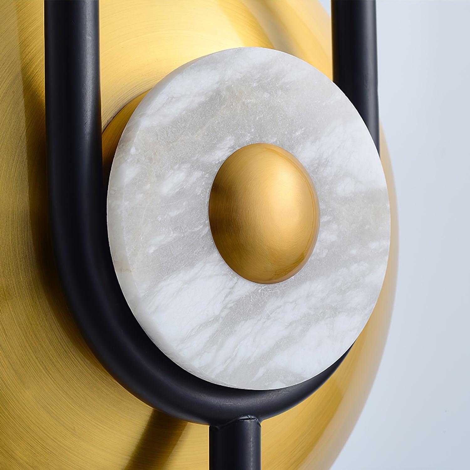 Close white marble-textured ring around gold centre, larger brushed gold disc behind and black frame at sides