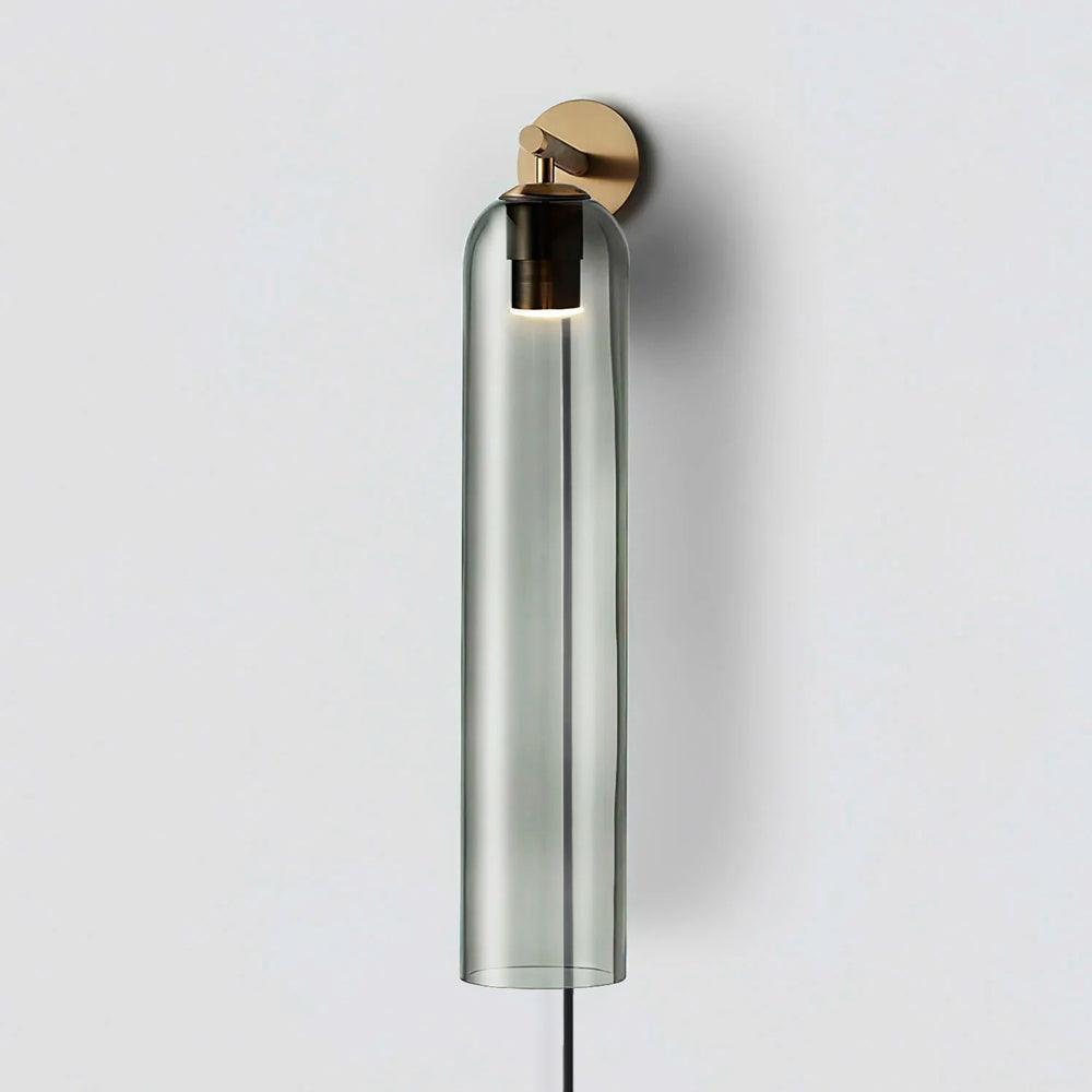 Smoke grey glass wall light with gold fitting and hanging cord