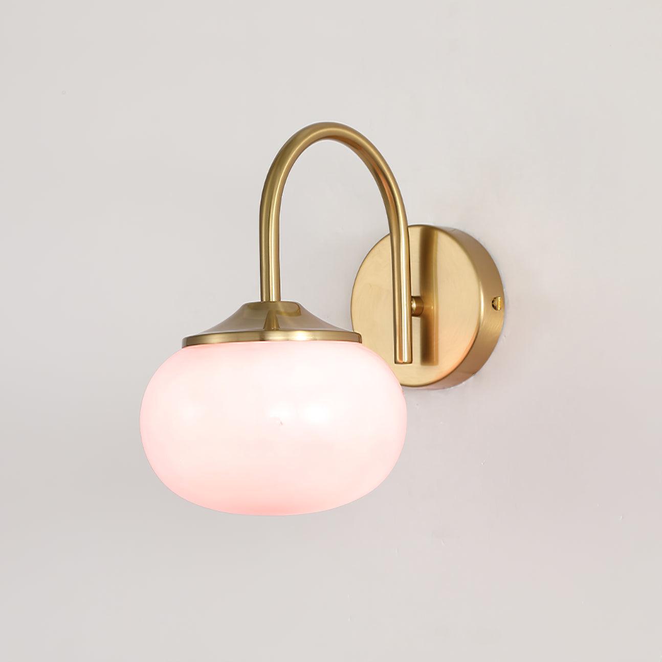 Soft pink-looking illuminated glass beneath the arched arm