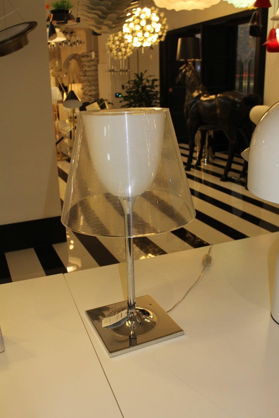 Chrome Prism layered table lamp on a display surface