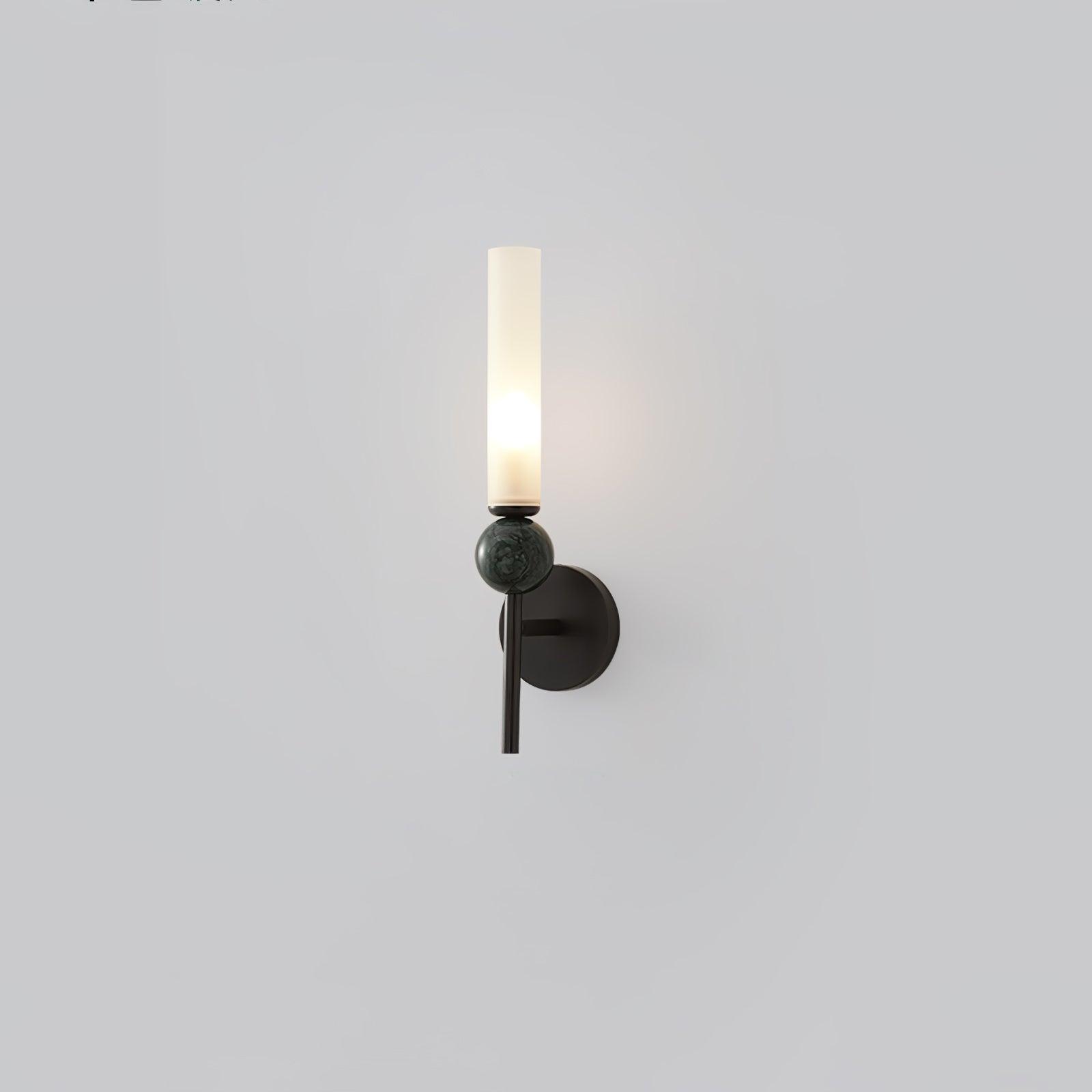 Alternate isolated view of black straight-stem wall lamp with green-grey mottled sphere and lit white cylinder