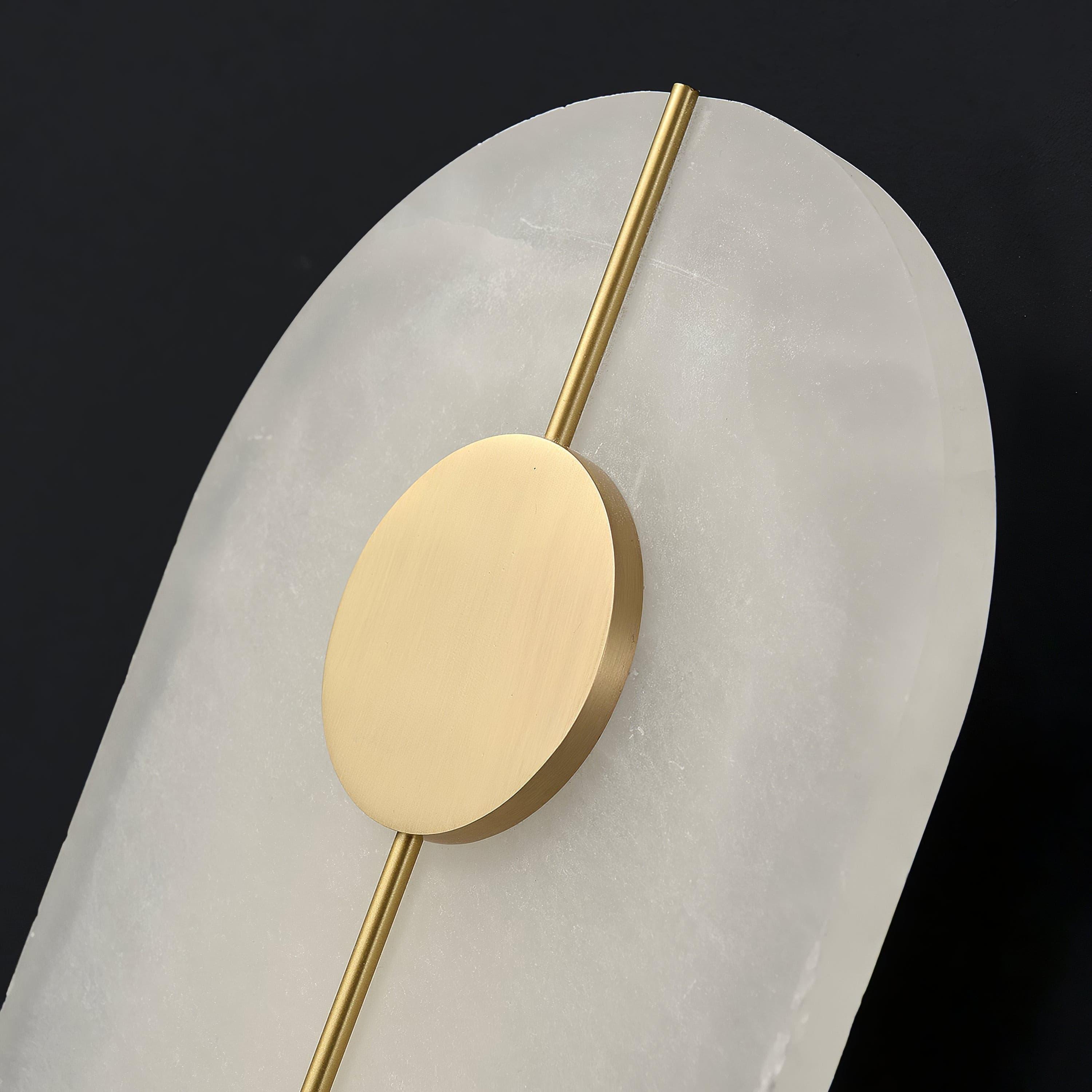 Round decorative disc above a pale patterned face