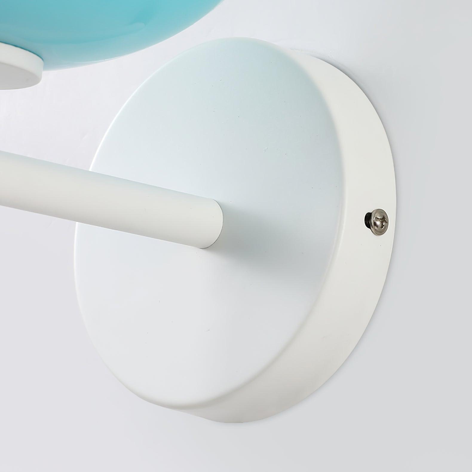Close white round wall plate, short arm and side screw beside the lower blue glass segment
