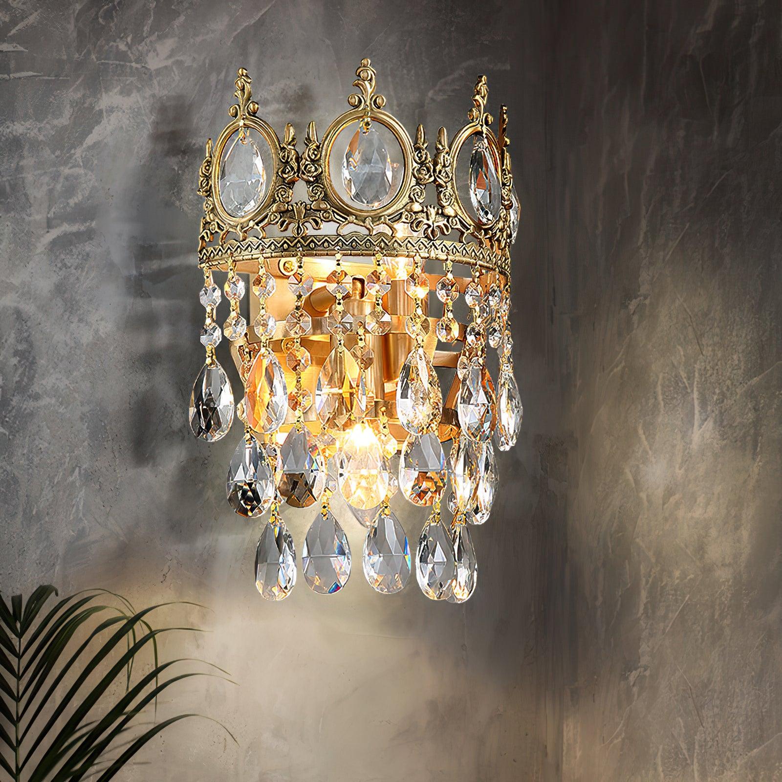 Illuminated crystal wall light on a stone-patterned wall