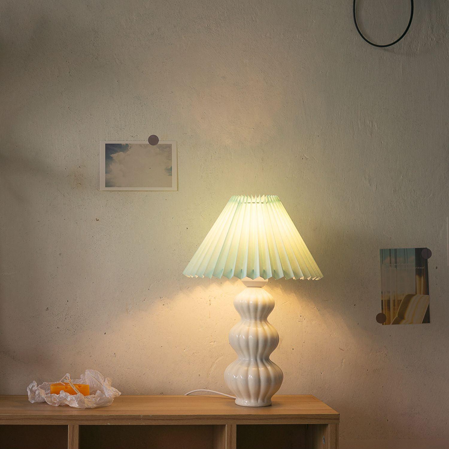 Leo lamp illuminated on a wooden cabinet