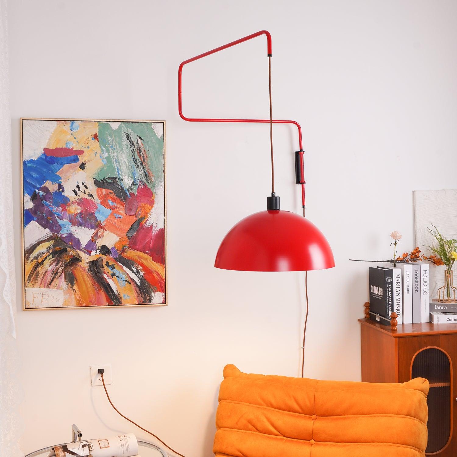 Red dome suspended beside artwork and seating