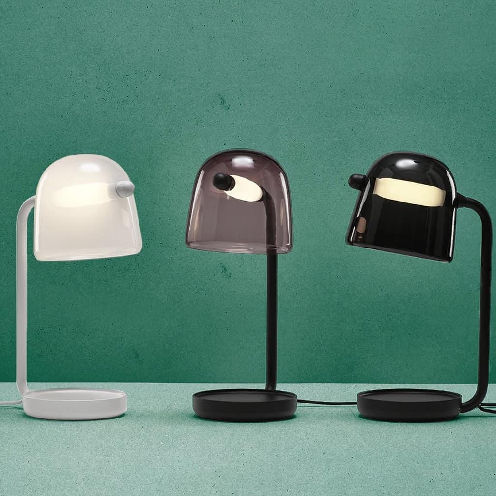Three Mona table lamp finishes shown together against green