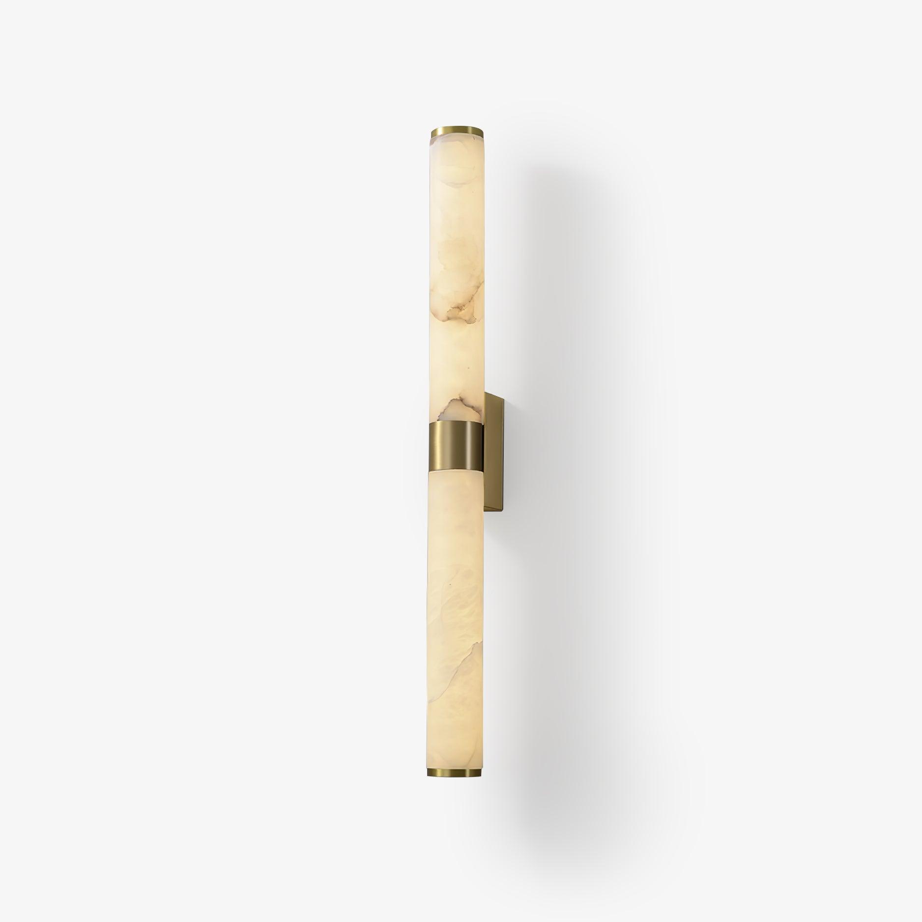 Brass-mounted alabaster tube against a pale wall