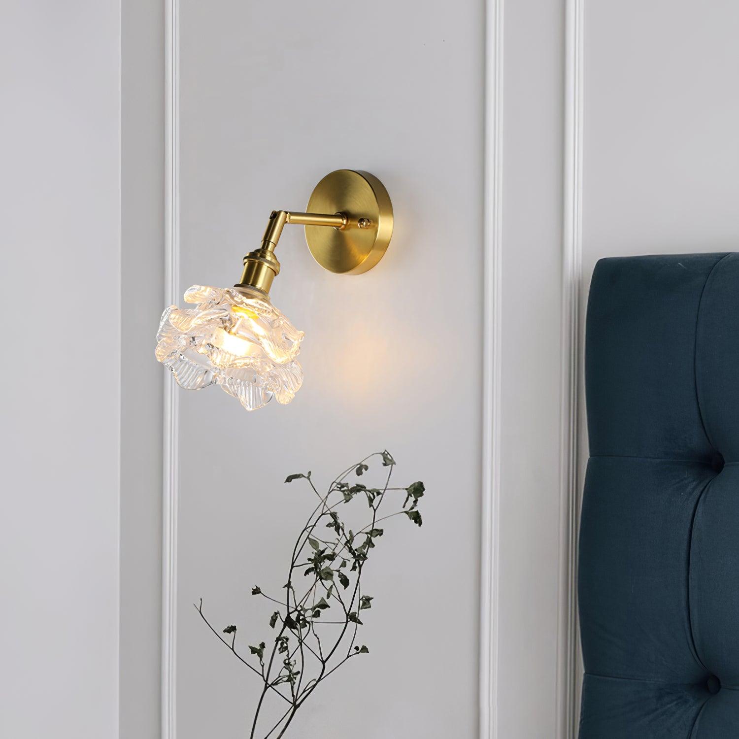 Kano wall lamp beside a blue upholstered bed